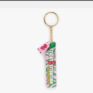 Kate Spade Pink and Green Bubble Gum Bag Charm still in the original packaging.